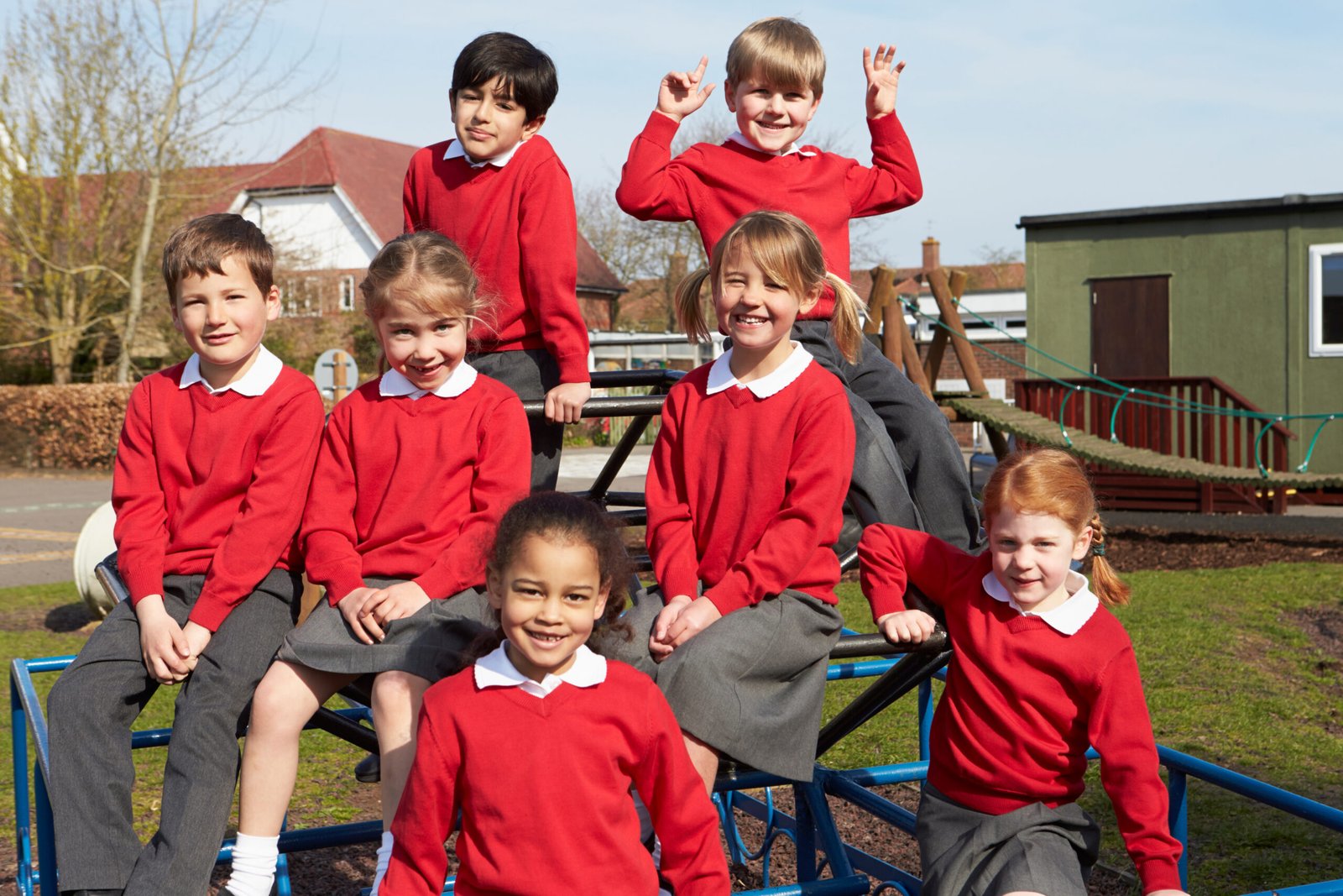 Portrait Of Elementary School Pupils On Climbing Equipment