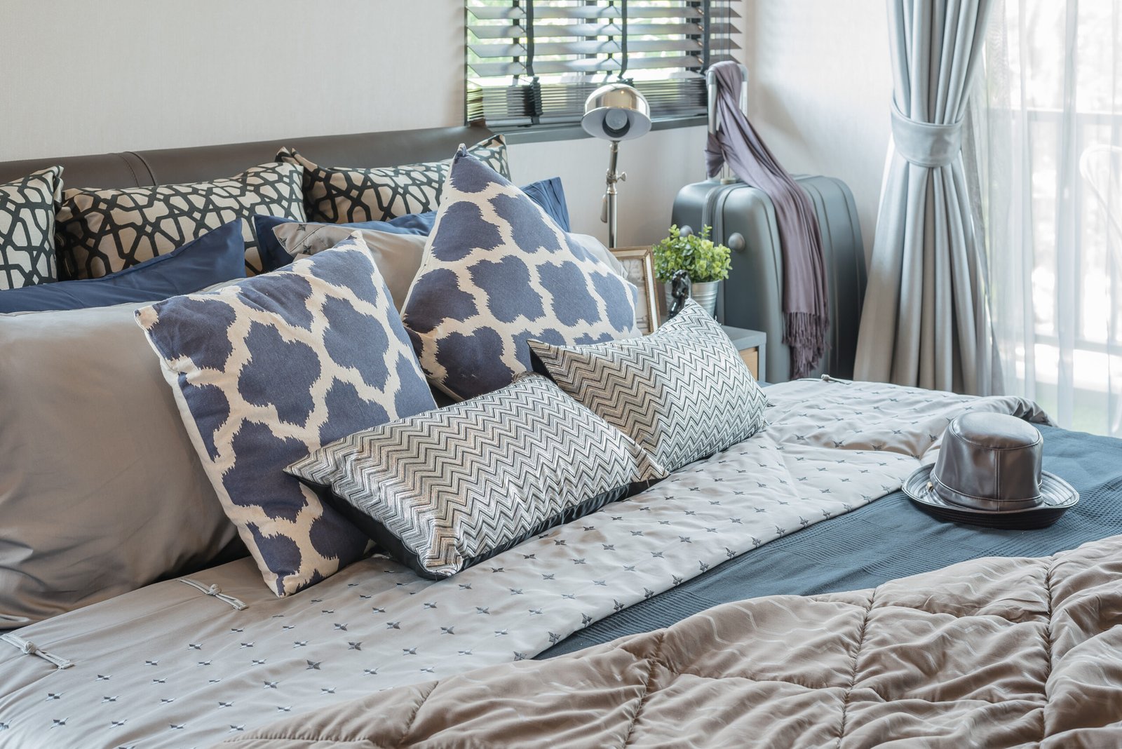 luxury bedroom with pillows on bed at home