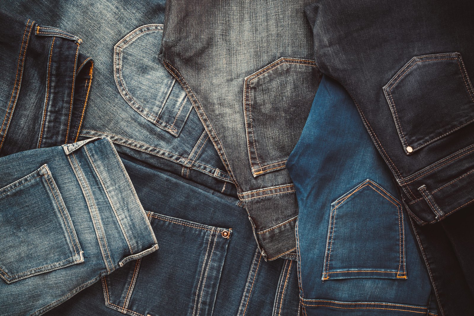 Fashion different jeans background. Retro toned.