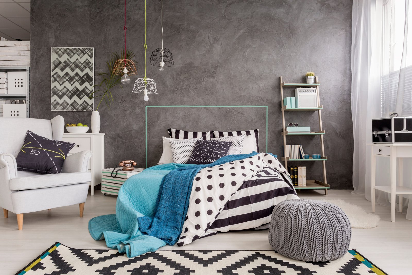 Spacious new design bedroom with carpet, armchair, large bed and decorative wall finish